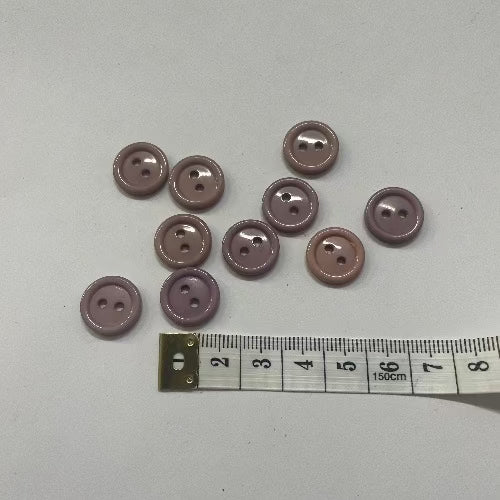 Plastic small pink/mauve buttons 14mm (1/2")
