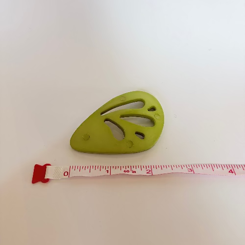Plastic "wing" statement buttons