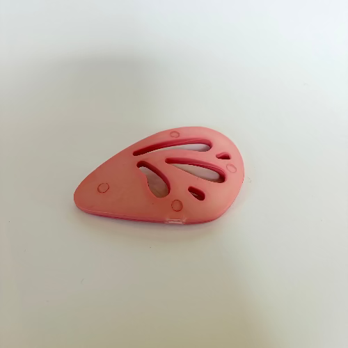 Plastic "wing" statement buttons