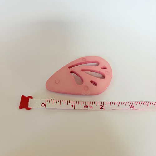 Plastic "wing" statement buttons