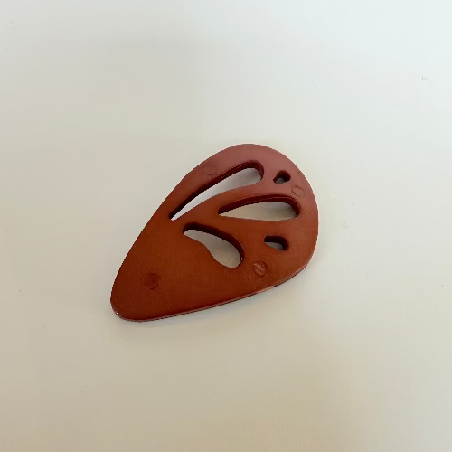 Plastic "wing" statement buttons
