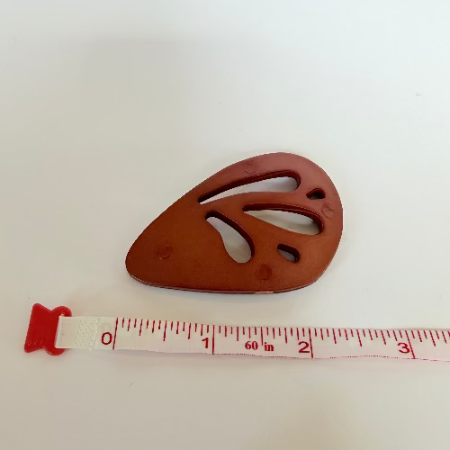 Plastic "wing" statement buttons