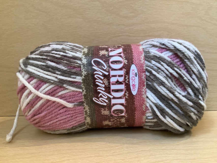 Color 4803 Tora. Light pink, off white, and grey variegated yarn