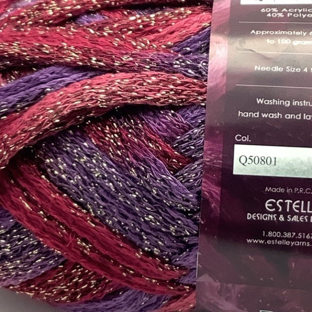 A purple to magenta ombré mesh yarn with golden shimmer