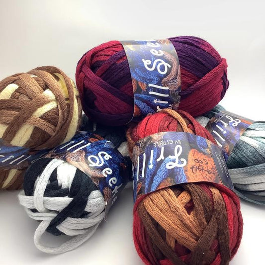 A group photo of several multi colour ombré mesh scarf yarns