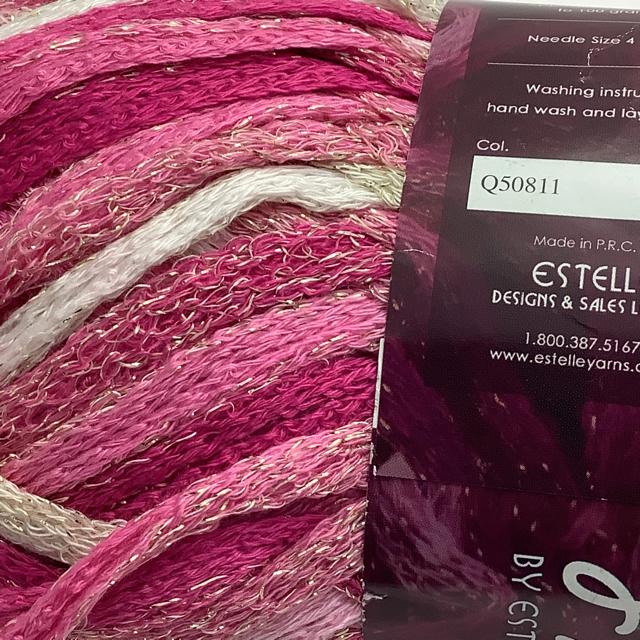 A magenta to white ombré mesh yarn with golden shimmer 